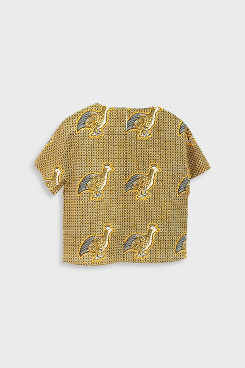 Gold bird on the print shirt